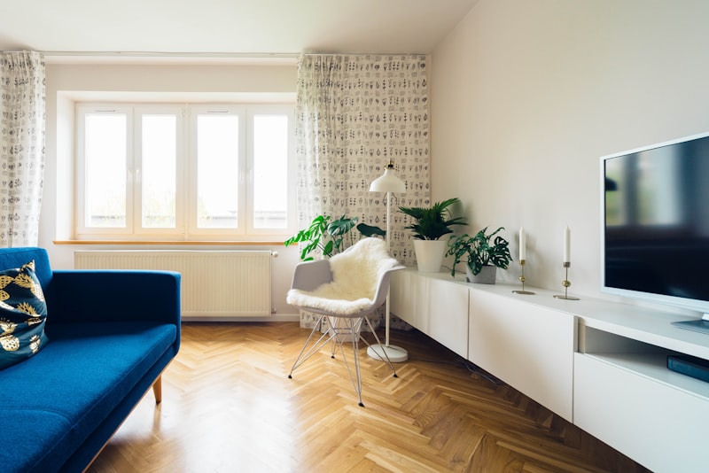 Modern apartment interior showing clean hardwood floors in afternoon light